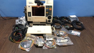 Medtronic Lifepak 12 with 2 x Physio Control AC Power Adaptors, 1 x Medtronics Battery Support System 2 and Job Lot of ECG Leads and Accessories (Powe