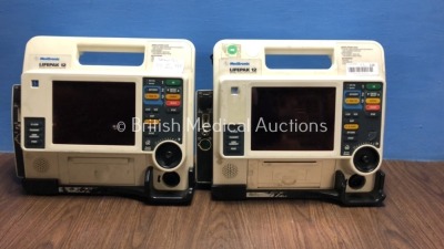 2 x Medtronics Lifepak 12 12-Lead Defibrillators with C02, SPO2, NIBP, ECG and Printer Options *Mfd 2009* Slight Casing Damage to 1 Unit - See Photo (Both Power Up with Stock Battery, Battery Not Included)