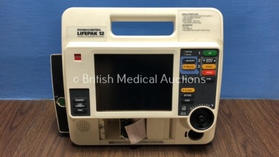 Medtronic Lifepak 12 Biphasic Defibrillator / Monitor Including ECG Options - Missing Printer Door *Mfd 2001* (Powers Up with Service Light using Stock Battery, Battery Not Included)