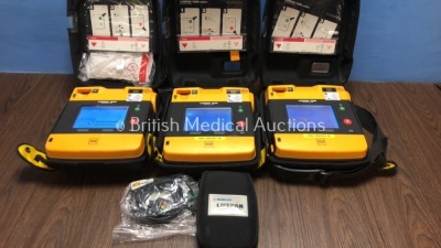 3 x Lifepak 1000 Defibrillators with 1 x 3 Lead ECG Lead and 3 x Physio Control Ref 11141-000156 Batteries in Carry Cases (All Power Up) *39942452 / 3