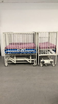 2 x Huntleigh Nesbit Evans Infant Cots with Mattresses