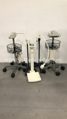 1 x Heine HL 1200 Patient Examination Lamp on Stand, 1 x Heine HL 5000 Patient Examination Lamp on Stand, 2 x Drager Docking Stations on Stands and 1 x Seca Stand on Weighing Scales