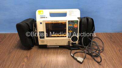 Medtronic Lifepak 12 Biphasic Defibrillator / Monitor with Screen Protector, Paddle Lead, 1 x Battery and CO2 Option *Mfd 2009* (Powers Up) *37620286*