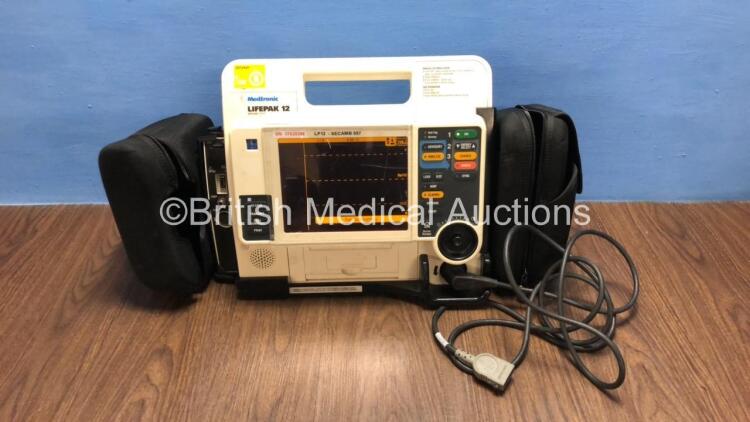 Medtronic Lifepak 12 Biphasic Defibrillator / Monitor with Screen Protector, Paddle Lead, 1 x Battery and CO2 Option *Mfd 2009* (Powers Up) *37620286*