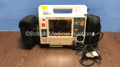 Medtronic Lifepak 12 Biphasic Defibrillator / Monitor with Screen Protector, Paddle Lead, 1 x Battery and CO2 Option *Mfd 2009* (Powers Up) *37620282*