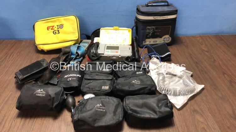 Mixed Lot Including 1 x Access ALS Automated External Defibrillator (Powers Up with Loose Battery Clip-See Photo) 1 x Max NIBP CAS 740 Vital Signs Monitor (No Power) 1 x EZ IO G3 Carry Bag, 8 x Merlin Medical BP Meters and 2 x Ferno Belts