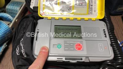 Mixed Lot Including 1 x Access ALS Automated External Defibrillator (Powers Up with Loose Battery Clip-See Photo) 1 x Max NIBP CAS 740 Vital Signs Monitor (No Power) 1 x EZ IO G3 Carry Bag, 8 x Merlin Medical BP Meters and 2 x Ferno Belts - 3