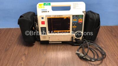 Medtronic /Physio Control Lifepak 12 Biphasic Defibrillator / Monitor with Screen Protector, Paddle Lead, 1 x Battery and CO2 Option *Mfd 2009* (Powers Up) *37797942*