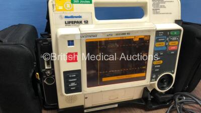 Medtronic /Physio Control Lifepak 12 Biphasic Defibrillator / Monitor with Screen Protector, Paddle Lead, 1 x Battery and CO2 Option *Mfd 2009* (Powers Up) *37797942* - 2