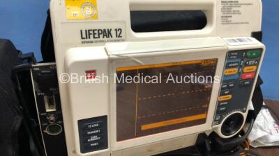 Medtronic /Physio Control Lifepak 12 Biphasic Defibrillator / Monitor with Screen Protector, Paddle Lead, 1 x Battery, 1 x MTCDP-H5 Module and CO2 Option *Mfd 2009* (Powers Up) *377 - 4