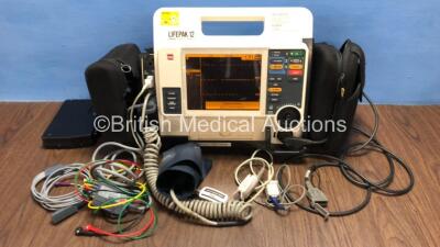 Medtronic Lifepak 12 Biphasic Defibrillator / Monitor with Screen Protector, ECG, Paddle, NIBP and SpO2 Leads, MTCDP-H5 Module, 1 x Battery and CO2 Option *Mfd 2009* (Powers Up) *37628611*