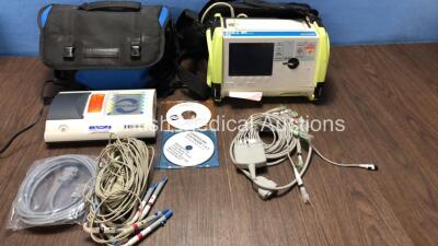 Mixed Lot Including 1 x Innomed HS80G-L Heart Screen Monitor with 1 x Power Supply and ECG Leads in Carry Bag (Powers Up) 1 x Zoll M Series Biphasic Defibrillator with 1 x Battery (Powers Up)