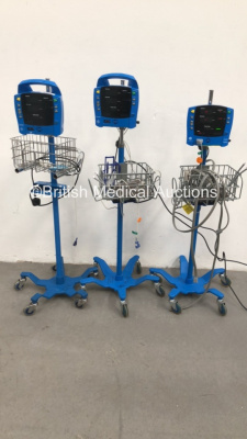 1 x GE Dinamap Carescape V100 Vital Signs Monitor on Stand with SPO2 Finger Sensor, BP Hose and Cuff, 1 x GE ProCare Auscultatory Vital Signs Monitor on Stand and 1 x GE ProCare Vital Signs Monitor on Stand (2 x Power Up) *S/N 2019194-001 / SDT10490731SA*