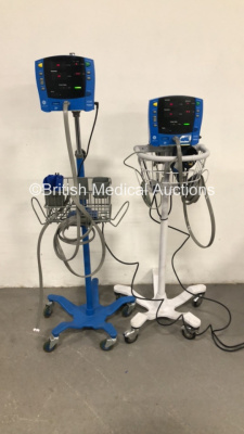 2 x GE Carescape Dinamap V100 Vital Signs Monitors on Stands with 2 x BP Cuffs and 2 x BP Hoses (Both Power Up) *S/N SDT10120449SP / SDT09330191SP*