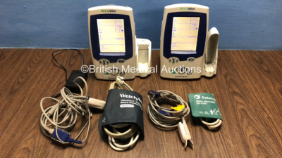 2 x Welch Allyn Spot Vital Signs LXi Monitors with 1 x Power Supply, 2 x BP Hoses and 2 x Cuffs with Leads (Both Power Up with Slight Cracks to 1 x Screen - See Photo))