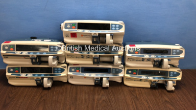 Job Lot of 7 x Alaris Syringe Pumps Including 4 x GS, 1 x CC and 2 x GH (4 x Power Up, 3 x No Power and Some Casing Damage - See Photos) *