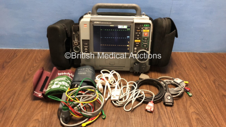 Medtronic Physio-Control Lifepak 15 12-Lead Monitor / Defibrillator *Mfd - 2010* Ref - 99577-000025 P/N - V15-2-000030 Software Version - 3207410-007 with Pacer, CO2, SPO2, NIBP, ECG, Auxiliary Power and Printer Options, 4 and 6 Lead ECG Leads, SPO2 Finge