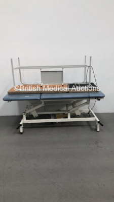 1 x Huntleigh Akron Electric Bariatric Patient Examination Couch with Controller and 1 x Unknown Make Static Patient Examination Couch