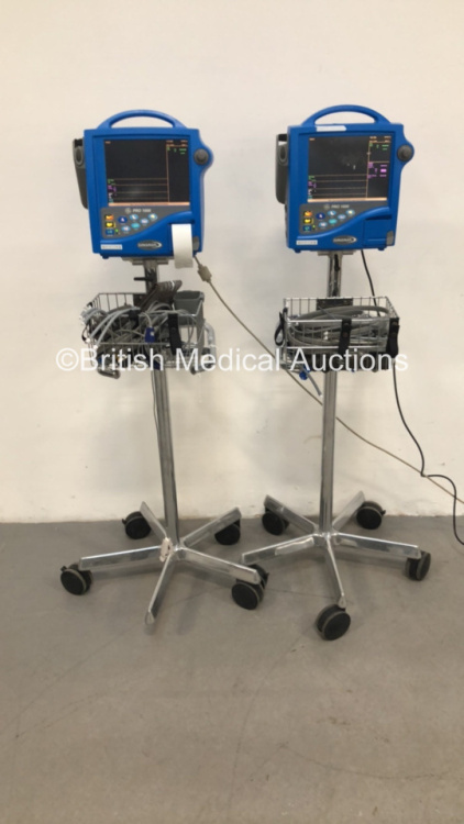 2 x GE Dinamap Pro 1000 Patient Monitors on Stands with 2 x SpO2 Finger Sensors, 2 x BP Hoses and 2 x BP Cuffs (Both Power Up-1 x Missing Wheel) * SN WAA05330028SA / WAA05240002SA * C4/2, C4/1