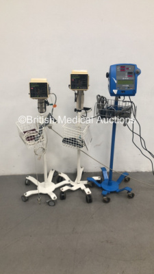 1 x GE Dinamap Pro 300 Patient Monitor on Stand with 1 x SpO2 Finger Sensor and 1 x BP Cuff and Hose and 2 x Criticare 506DXN Comfort Cuff Patient Monitors on Stands with 2 x BP Hoses,2 x BP Cuffs and 2 x SpO2 Finger Sensors (All Power Up) * SN 400385589