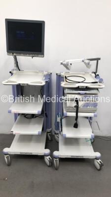 2 x Olympus Stack Trolleys Including Olympus OEV191H Monitor,Olympus Evis Lucera CV-260SL Proccessor,Olympus MAJ-1154,Olympus Keyboard and Olympus Evis Lucera CLV-260SL Proccessor/Light Source (Powers Up) * SN 7821033 / 7722724 / 7712096 *