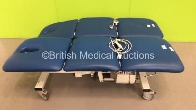 1 x Plinth 2000 3-Way Electric Patient Examination Couch with Controller and 1 x Unknown Make 3-Way Electric Patient Examination Couch with Controller (Both Power Up)