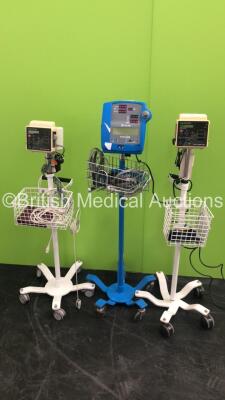 1 x GE Dinamap Pro 300 Patient Monitor on Stand with 1 x SpO2 Finger Sensor and 1 x BP Cuff and Hose and 2 x Criticare 506DXN Comfort Cuff Patient Monitors on Stands with 2 x BP Hoses,2 x BP Cuffs and 2 x SpO2 Finger Sensors (All Power Up) * SN 400385589