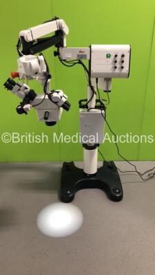 Leica M680 Dual Operated Surgical Microscope with 2 x Binoculars, 4 x 10x/21B Eyepieces, f250mm Lens and Lemke Vision XL202 Light Source on Stand (Powers Up with Good Bulb)