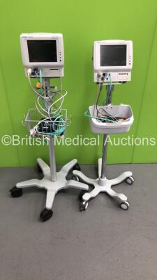 2 x Fukuda Denshi DS-7100 Patient Monitors on Stands with Assorted Leads (Both Power Up) *SN 50001979 / 50001980*