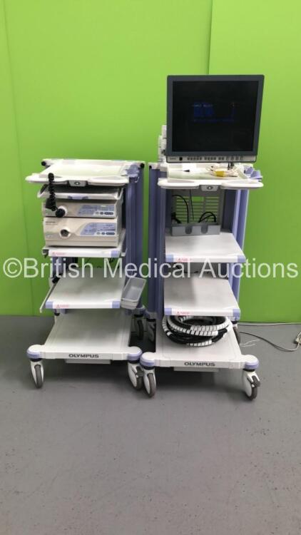 2 x Olympus Stack Trolleys with Olympus OEV191H Monitor, Olympus Evis Lucera CV-260 Digital Processor, Olympus Evis Lucera CLV-260SL Light Source, Olympus ECS-260 Connector Cable and Olympus MAJ-1154 Pigtail Connector (Powers Up)