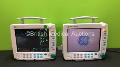 2 x GE Datex Ohmeda S/5 F-FM01 Patient Monitors with 4 x GE SM 201-6 Batteries, 2 x GE Type E-PSMP-00 Modules Including ECG, SpO2, T1, T2, P1, P2 and NIBP Options (Both Power Up, 1 with Missing Light Cover-See Photo) *S/N 6606949 / 6662268 / 6827693 / 659