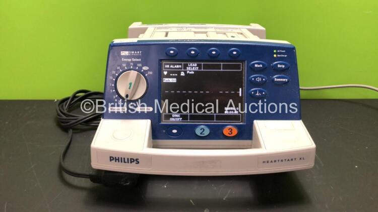 Philips Heartstart XL Defibrillator Including ECG and Printer Options with 1 x Paddle Lead and 1 x Battery (Powers Up with Damage-See Photo)