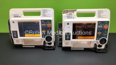 2 x Medtronic Lifepak 12 Biphasic Defibrillator / Monitors Including 1 x CO2, ECG, SpO2, NIBP and Printer Options *Mfd 2009 / 2005* (Both Power Up with Stock Battery - Service Light on and Damaged Casing -See Photo)