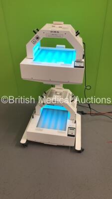 2 x Waldmann UV 200 AL Phototherapy Lights and 2 x Waldmann UV 181 AL Phototherapy Lights (All Power Up - Trolley Missing 1 x Wheel) *S/N HH1168*