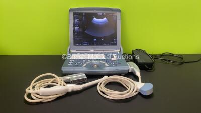 GE Voluson e Portable Ultrasound Scanner *Mfd - 09/2011* with 1 x E8C-RS Ultrasound Transducer / Probe *Mfd - 02/2014* (Damaged Head - See Photo), 1 x AB2-7-RS Ultrasound Transducer / Probe and Power Supply (Powers Up) *B54789*