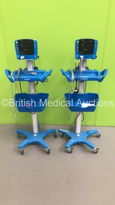 2 x GE Carescape V100 Dinamap Patient Monitors on Stands with 2 x SpO2 Finger Sensors (Both Power Up) * SN SH615536622SA / SH615536625SA *