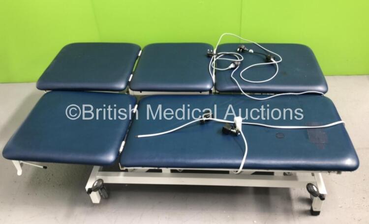 2 x Huntleigh Akron Electric Patient Examination Couches with 1 x Controller (Both Unable to Test Due to Disconnected Controllers-1 x Couch Cushion Repaired/Damaged)