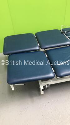 2 x Huntleigh Akron Electric Patient Examination Couches with 1 x Controller (Both Unable to Test Due to Disconnected Controllers-1 x Couch Cushion Repaired/Damaged) - 2