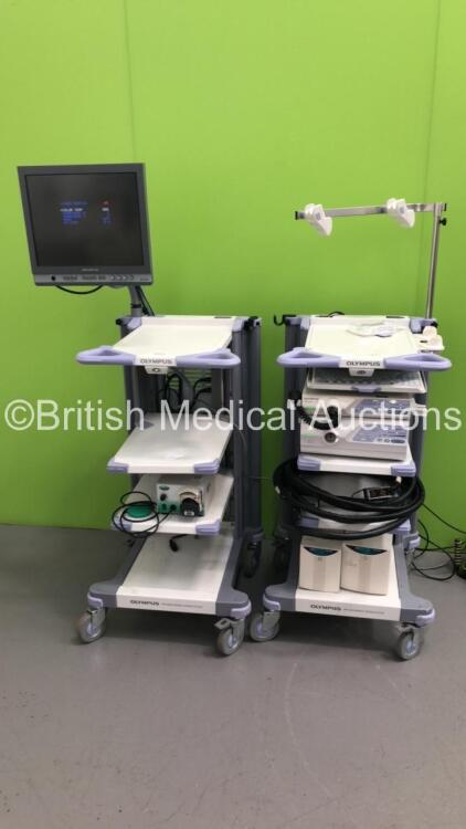 2 x Olympus Stack Trolleys Including Olympus OEV181H Monitor,Olympus Evis Lucera CV-260 Processor,Olympus Evis Lucera MAJ-1154 Pigtail Connector,Olympus Evis Lucera CLV-260 Processor/Light Source Unit,Olympus Keyboard,Olympus Connector Cables and 2 x UPS