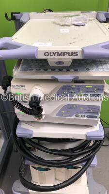 2 x Olympus Stack Trolleys Including Olympus OEV181H Monitor,Olympus Evis Lucera CV-260 Processor,Olympus Evis Lucera MAJ-1154 Pigtail Connector,Olympus Evis Lucera CLV-260 Processor/Light Source Unit,Olympus Keyboard,Olympus Connector Cables and 2 x UPS - 3