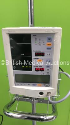 1 x Datascope Accutorr Plus Patient Monitor on Stand with 1 x BP Hose and 1 x GE Carescape V100 Dinamap Patient Monitor on Stand (Both Power Up) - 3