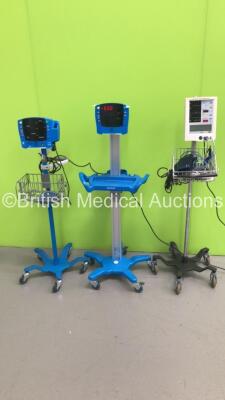 1 x GE Carescape V100 Vital Signs Monitor on Stand (No Power), 1 x GE Dinamap (Unknown Model) Vital Signs Monitor on Stand (Powers Up with E00 Displayed) and 1 x Mindray Accutorr Plus Vital Signs Monitor on Stand with SPO2 Finger Sensor, BP Hose and Cuff 