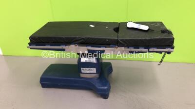 Maquet Alphastar Electric Operating Table Model 1132.11A0 with Cushions and Controller (Powers Up-Large Hydraulic Fluid Leak) * SN 01452 * * Mfd 2005 *