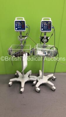 2 x CSI Criticare 506N3 Vital Signs Monitors on Stands with 2 x SPO2 Finger Sensors and 2 x BP Hose and Cuffs (Both Power Up)