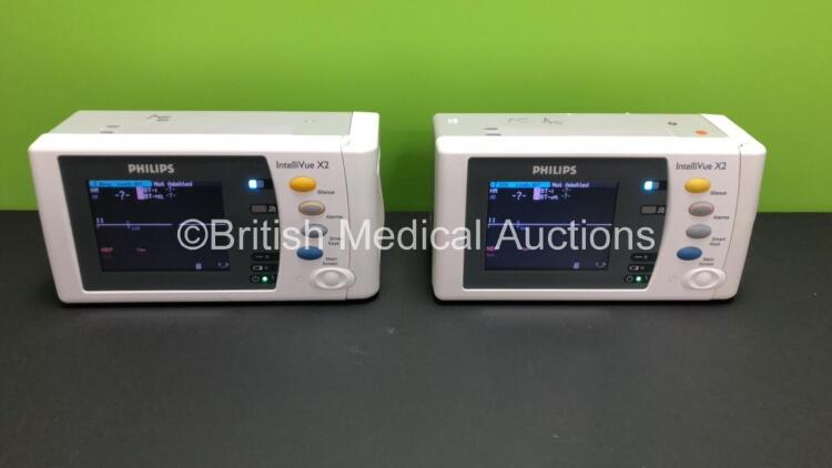 2 x Philips IntelliVue X2 Handheld Patient Monitors S/W Rev K.21.42 / K.21.42 with Press/Temp, NBP, SpO2 and ECG/Resp Options with 2 x Batteries (Both Power Up with 1 x Damaged Casing- See Photo) *Mfd 2009 - 2009* *SN-DE83629217 - DE83629193*