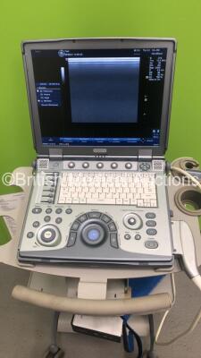 GE Logiq e Portable Ultrasound Scanner Ref 5322678 *S/N 141073WX7* **Mfd 03/2010** Software Version R5.2.2 with 1 x Transducer / Probe (12L-RS Ref 5141337 *Mfd 11/2015**) on GE Mobile Cart (Powers Up) - 2