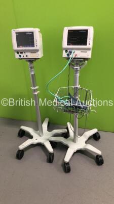 2 x Fukuda Denshi DS-7100 Patient Monitors on Stands with ECG/Resp,SpO2,NIBP,BP,Temp and CO2 Microstream Options and Leads (Both Power Up)