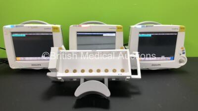 3 x Philips IntelliVue MP30 Patient Monitors *Mfds - 1 x 2008, 1 x Unknown and 1 x 2009* (All Power Up with Damaged Casing - See Photos) with 1 x Philips Module Rack