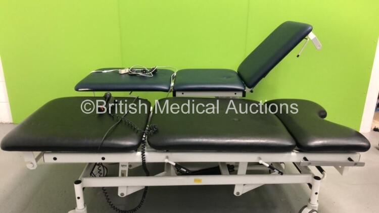 1 x Huntleigh Akron 3-Way Electric Patient Examination Couch with Controller and 1 x Huntleigh Nesbit Evans 3-Way Electric Patient Examination Couch with Controller (Both Power Up) * Asset No FS0046188 / FS0046191 *