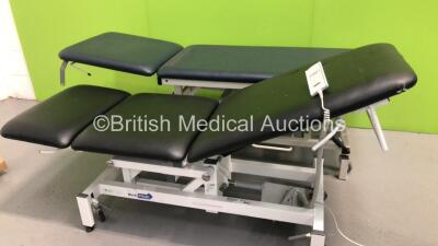 1 x Medi Plinth 3-Way Electric Patient Examination Couch with Controller and 1 x Huntleigh Akron Hydraulic Patient Examination Couch (Powers Up,Hydraulics Tested Working-Damage to Cushions-See Photos) * Asset No FS 0021501 / FS0179688 * - 2